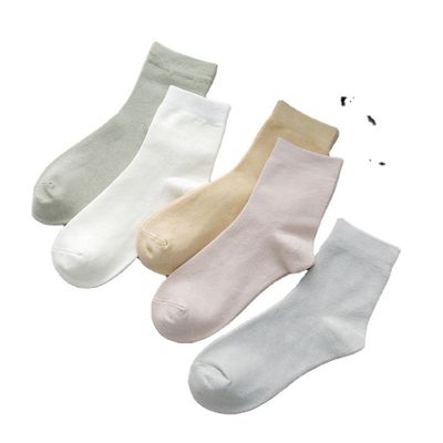 Estilo regular Calcetines de invierno de algodón de patrón sólido para mujeres Material de bambú de punto