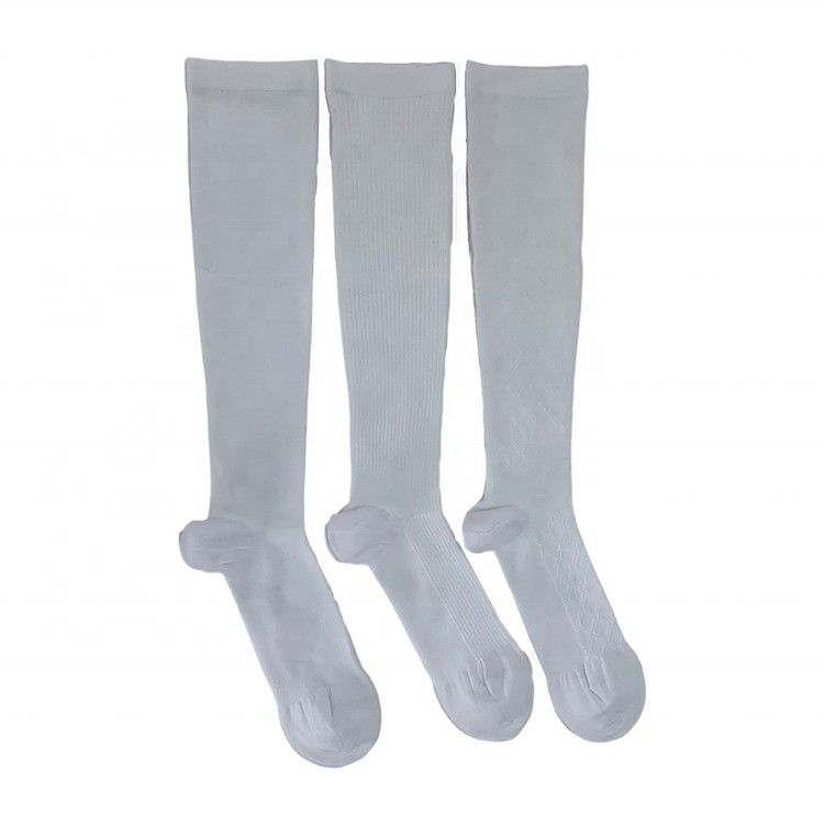 Estilo regular Calcetines deportivos de compresión blanca de larga duración Calcetines de rodilla para niños